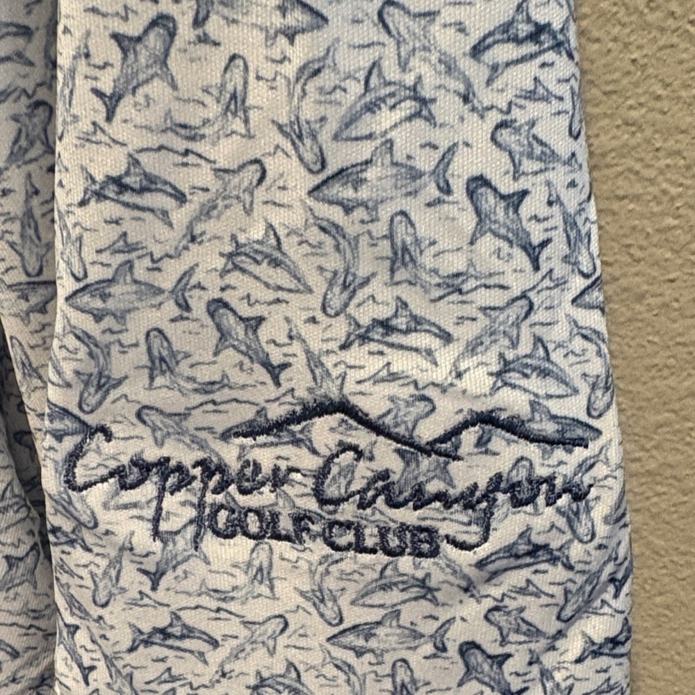 New w/tag!Greg Norman Collection White and Blue shark Patterned Polo. Size Large - Picture 2 of 7